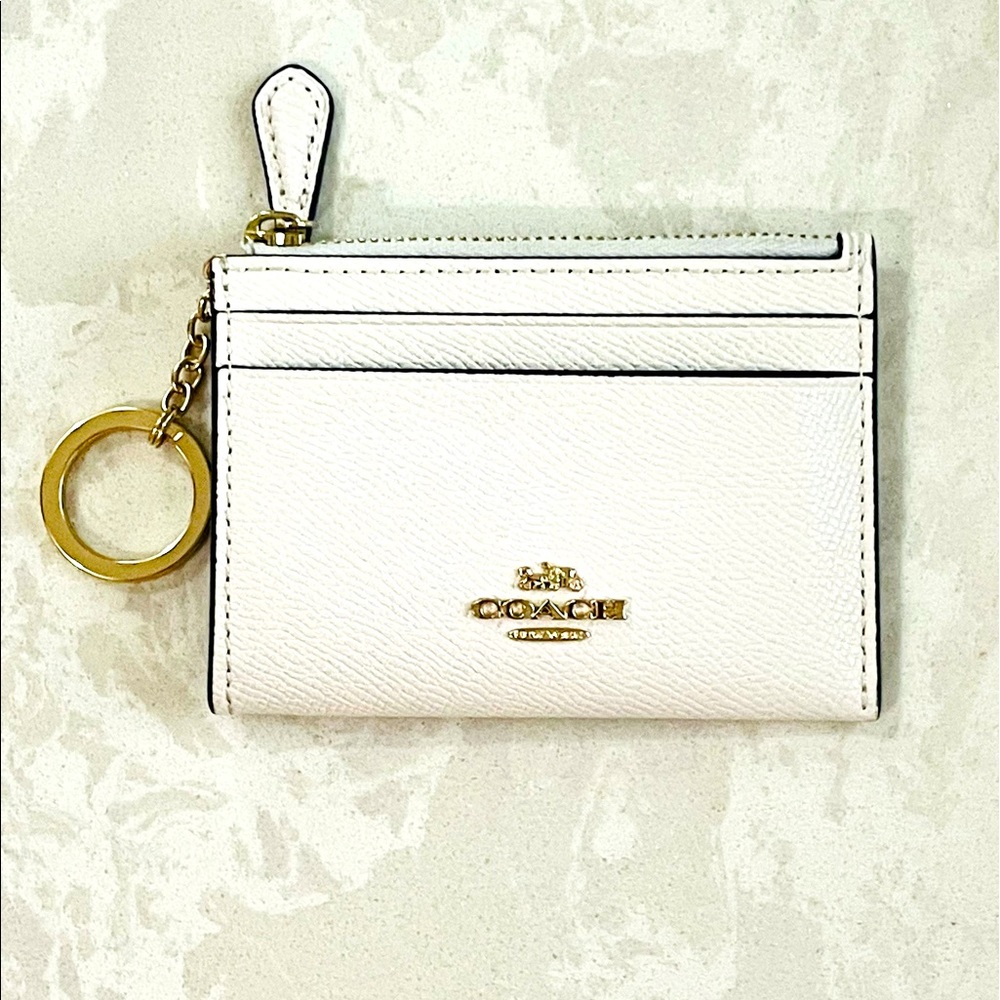 Coach wallet keychain. White and gold